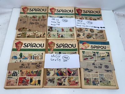 Plusieurs vieilles bandes dessinées sont posées sur une table
