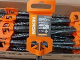 many pieces of black and orange construction tools in a box