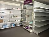 many empty shelves in a store that are on the floor