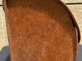 a brown bag sitting on top of a black table