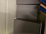 boxes of louis vuitton are stacked on top of each other in a closet
