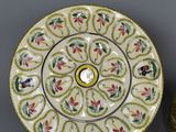 a lot of different plates and bowls on the table