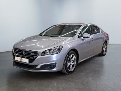 the silver car is parked in a large room with a black floor