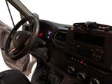 a dashboard of a vehicle with a steering wheel and dashboard controls