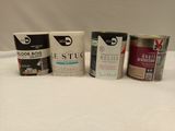 several cans of paint are lined up on a white surface