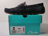 clarks men ' s driving shoes in a box on a table