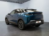 the rear end of a blue suv parked in a garage