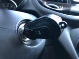 a close up of a car dashboard with a steering wheel