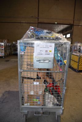 a metal cart with a sign on it in a warehouse