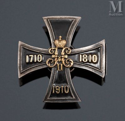 an iron cross with a crown on it sitting on top of a table