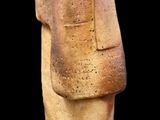 an image of a stone statue of a man ' s head on a black background