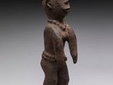 an image of a statue of a man standing on a black base