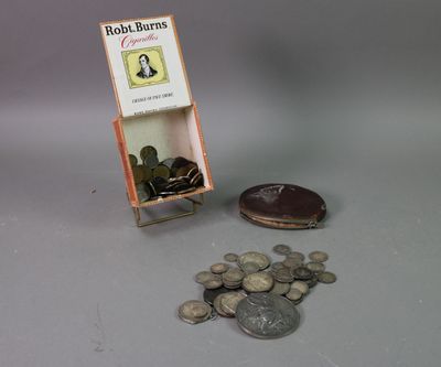 a small display of coins and a book on a table