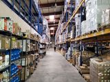 a large warehouse filled with lots of boxes and pallets