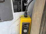 a yellow phone sitting on the seat of a car
