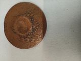 a coin with a picture of a ship on it