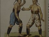 a book with a picture of two men fighting each other