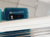 a close up view of a bathroom mirror with a toothbrush in it