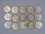 a close up of a bunch of coins sitting on top of a table