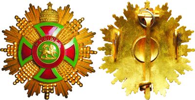 deux insignes dorés et verts surmontés d'une couronne