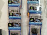 a lot of different types of electronic gadgets on display