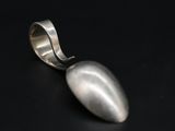 a close up of a spoon on a black surface