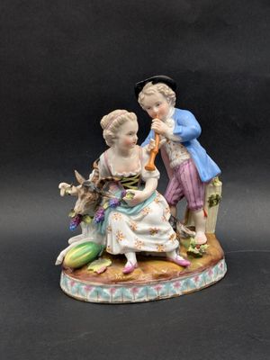 a figurine of two people sitting on a table
