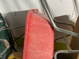 a wheelbarrow and a cart in a garage