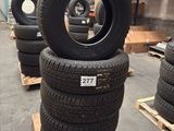 tires are stacked on pallets in a warehouse with pallets of pallets
