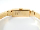 an image of a close up of a wrist watch on a white surface