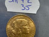 a close up of a gold coin with a label on it