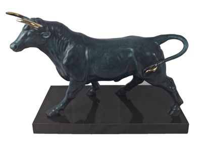 statue of a bull on a black base on a white background