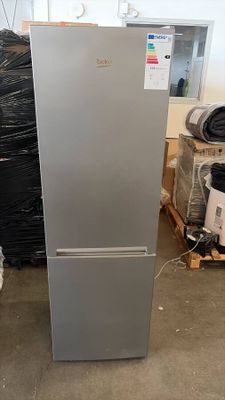 a refrigerator that is sitting in the middle of a room