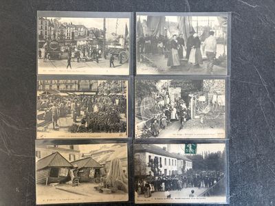 an old black and white photo of a group of people on a street