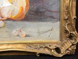a picture of a painting of an orange on a table