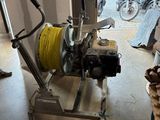 a machine that is sitting on a cart in a garage