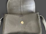 silver leather cross body bag with gold buttons on the front