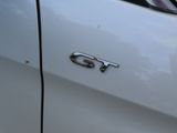 a close up of a car ' s emblem on the side of the car