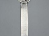 an image of a knife with a coin on it