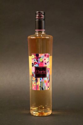 a bottle of wine with a pink label on it