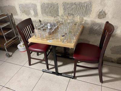 a small table with wine glasses and wine glasses on it