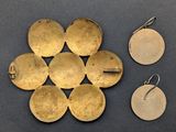 several pieces of brass are arranged on a table