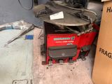 a machine that is sitting on a table in a garage