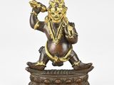 an image of a bronze statue of a man with a bird in his hand