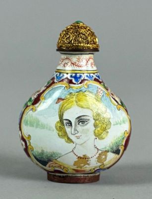 a small vase with a picture of a woman on it