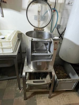 a machine that is sitting in a kitchen next to a sink