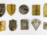 a close up of a group of metal objects on a white surface