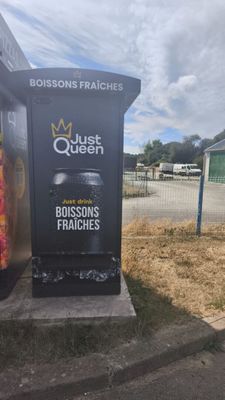 a sign for a french restaurant on the side of the road