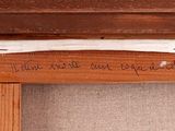 a picture of a wooden bench with writing on it