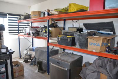 a room with a lot of items on the shelves